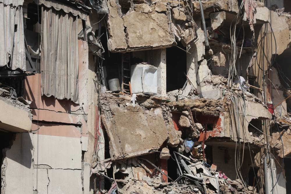 A view of a damaged building at the site of Friday's Israeli strike, as search and rescue operations continue, in Beirut's southern suburbs, Lebanon on Saturday. REUTERS