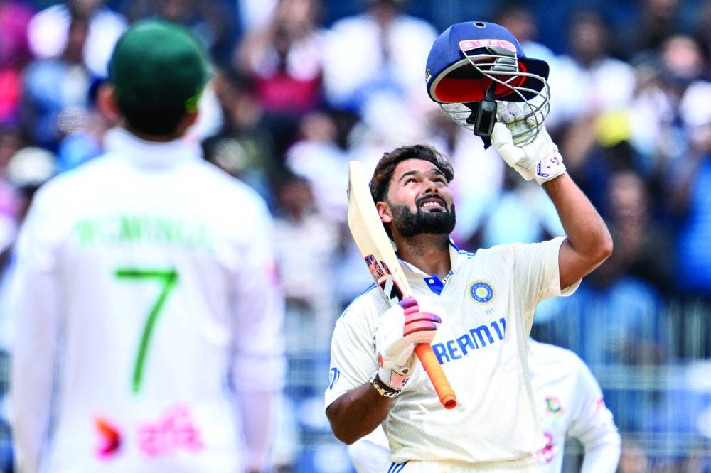 India’s Rishabh Pant celebrates after scoring a century (100 runs) during the third day of the first Test against Bangladesh at the MA Chidambaram Stadium in Chennai on Saturday. (AFP)