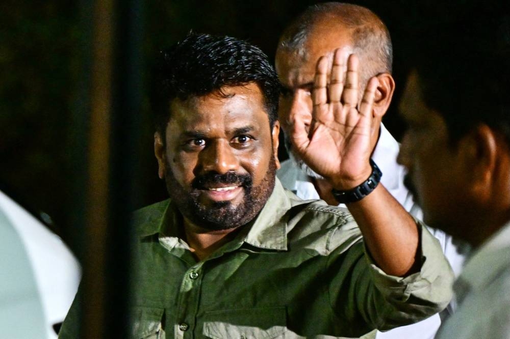 National People's Power (NPP) party's presidential candidate Anura Kumara Dissanayaka, arrives at the Election Commission office in Colombo on Sunday, after his victory at Sri Lanka's presidential election. AFP