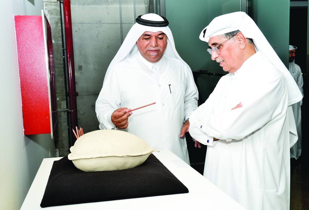 HE Dr Hamad Bin Abdulaziz al-Kawari with Khalifa al-Obaidly at the unveiling of the two exhibitions Sunday at the Fire Station: Artists in Residence.