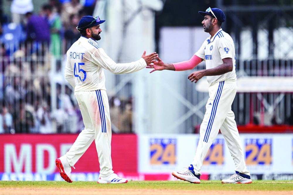 India’s captain Rohit Sharma (left) celebrates with teammate Ravichandran Ashwin at the end of the first Test against Bangladesh at the MA Chidambaram Stadium in Chennai yesterday. (AFP)