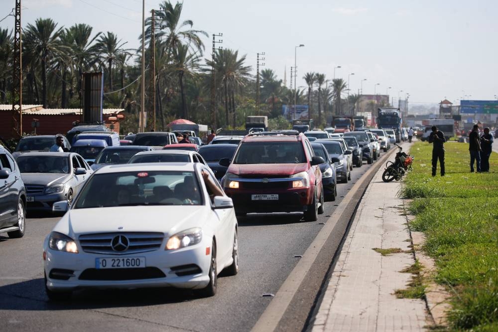 People in heavy traffic drive north from Lebanon's southern coastal city Sidon as some of them flee Israeli bombardment in Lebanon on Monday. REUTERS