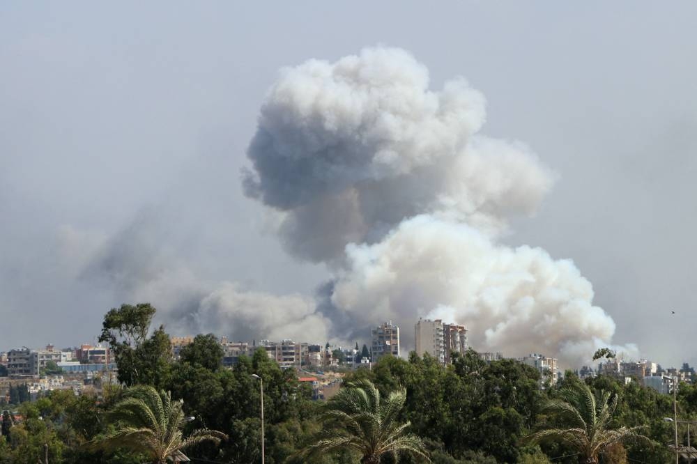 Smoke billows from a site targeted by Israeli shelling in the southern Lebanese village of Burj el-Shmali on Monday. AFP