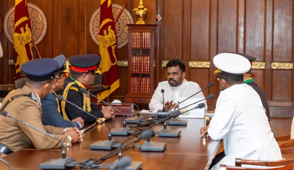 Sri Lanka's new President Anura Kumara Dissanayake speaks with the military and police chiefs after being sworn in as president at the Presidential Secretariat, in Colombo, Sri Lanka, on Monday. Sri Lanka President Media/Handout via REUTERS