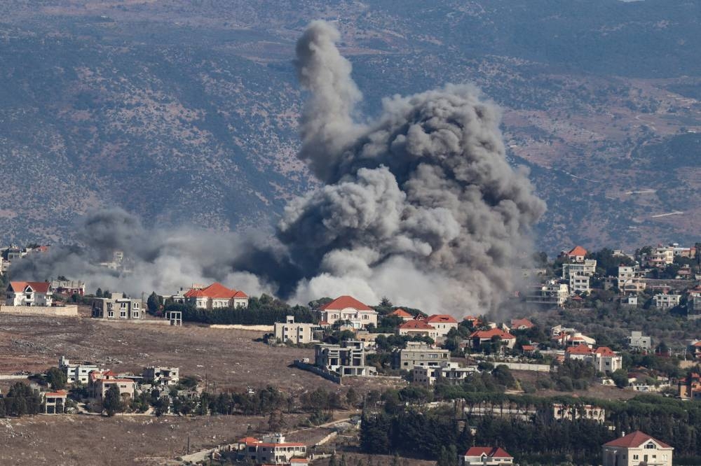 Smoke rises from the site of an Israeli airstrike that targeted the southern Lebanese village of Khiam on Wednesday. AFP