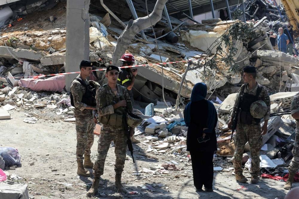Lebanese soldiers stand guard at the site of an Israeli strike on the Mount Lebanon village of Maaysra, east of the Christian coastal town of Byblos on Wednesday. AFP