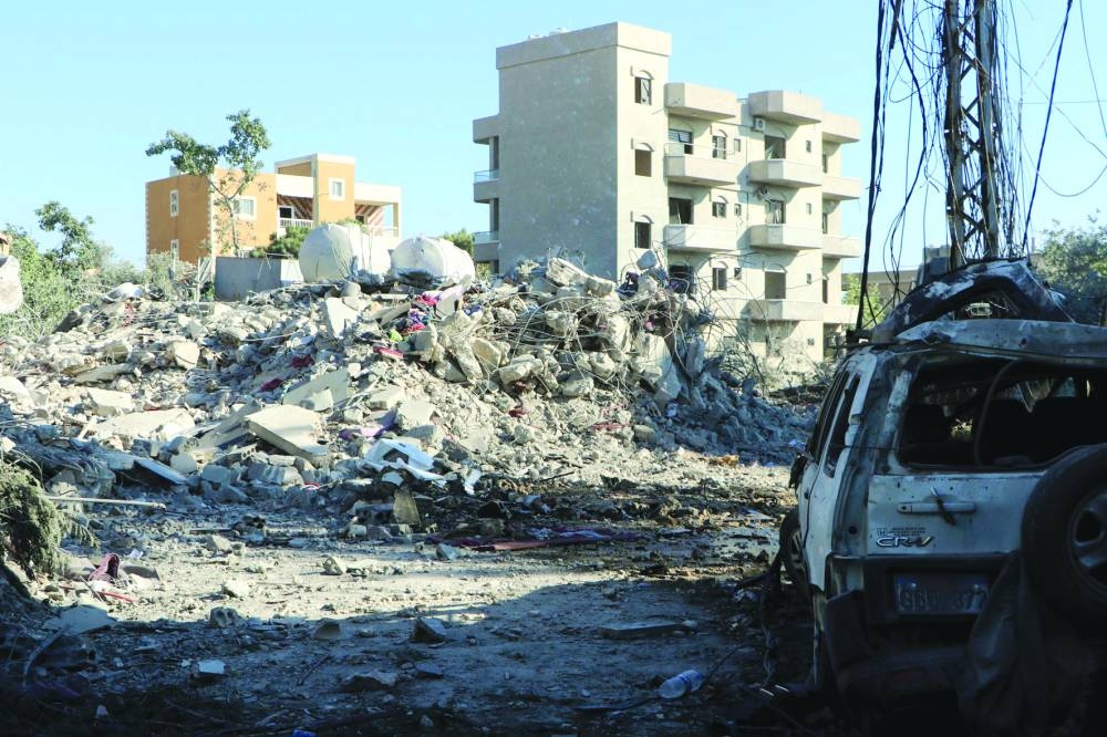 Debris and rubble from destroyed building lie at the scene of an Israeli strike in the southern Lebanese village of Burj el-Shmali Wednesday. 