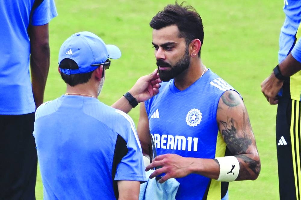 
India’s head coach Gautam Gambhir (left) speaks with Virat Kohli during a practice session at the Green Park Cricket Stadium in Kanpur ahead of their second Test against Bangladesh. (AFP) 