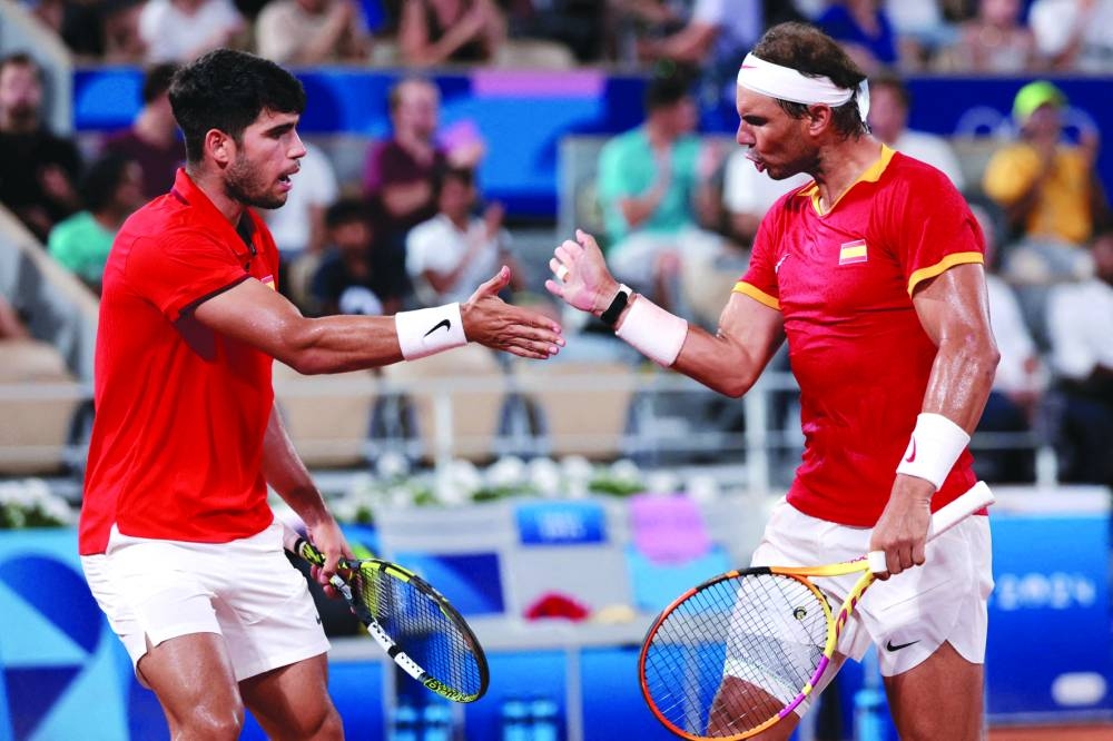 
Carlos Alcaraz (left) of Spain and compatriot Rafael Nadal react during their match against American pair of Austin Krajicek and Rajeev Ram during the Olympic Games doubles match in Paris. (AFP) 