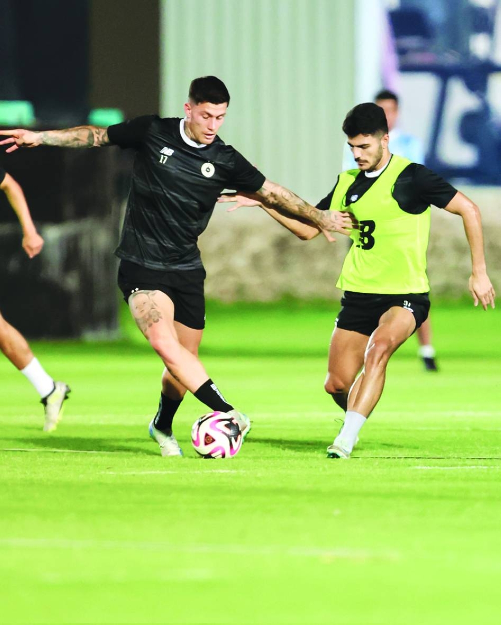Al Sadd (left) and Al Gharafa players at a training session on Wednesday, on the eve of their Ooredoo Stars League match at the Jassim Bin Hamad Stadium.