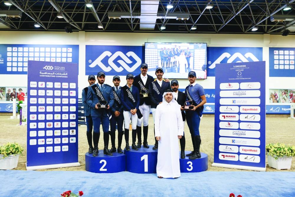 Medium Class team and individual winners pose with Jaber al-Mulla, Qatar Equestrian Federation’s (QEF) Board Member, at its Indoor Arena on Friday.