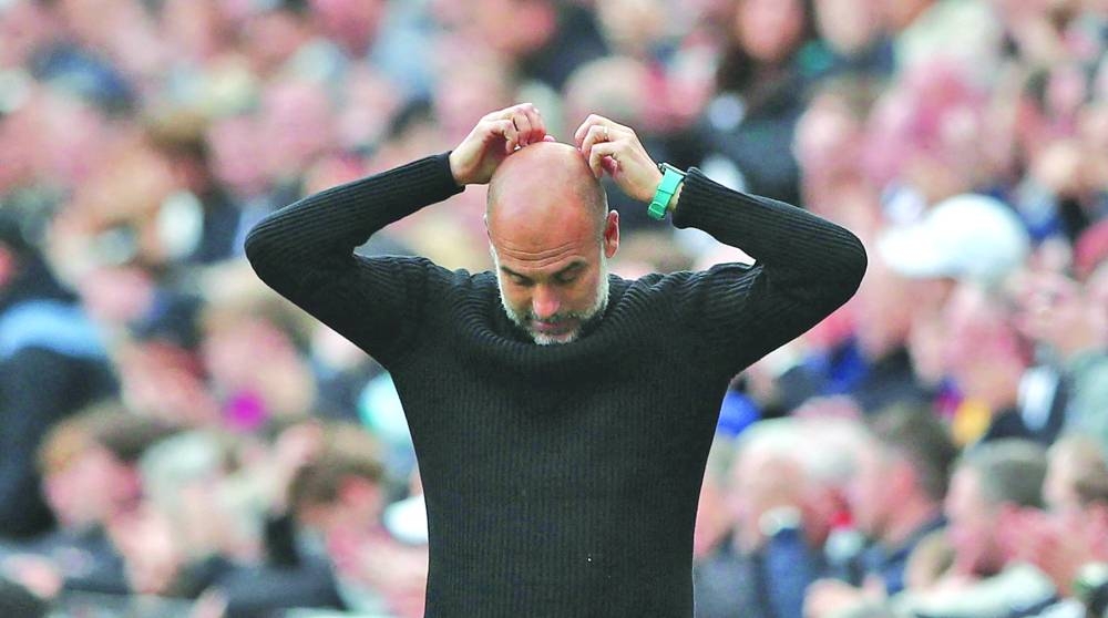 Manchester City manager Pep Guardiola reacts after his team’s match against Newcastle United at St James’ Park on Saturday. (Reuters)