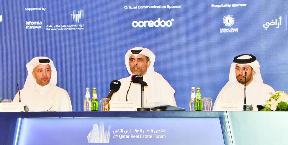 HE Engineer Khalid bin Ahmed al Obaidli, President of the Real Estate Regulatory Authority (Aqarat), in the middle with officials.