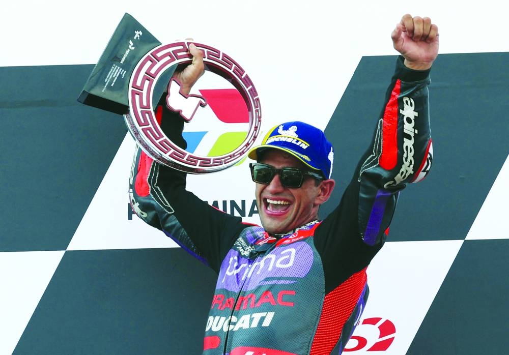 Prima Pramac Racing’s Jorge Martin celebrates on the podium after winning the Indonesian Grand Prix at Mandalika International Street Circuit, Mandalika, Indonesia, yesterday. (Reuters)