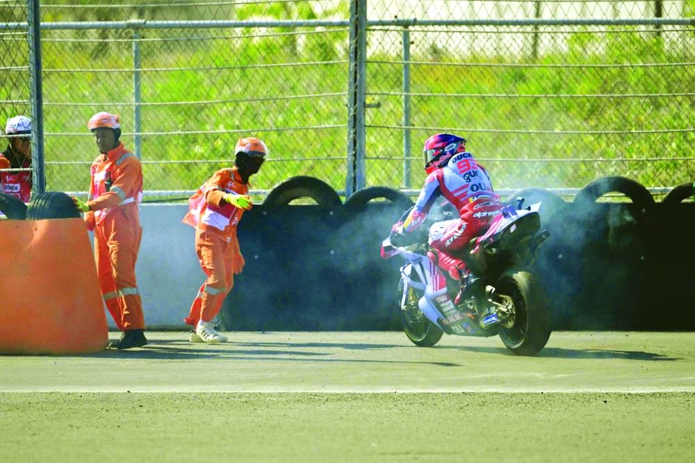 Gresini Racing MotoGP’s Spanish rider Marc Marquez retires during the MotoGP race of the Indonesian Grand Prix at the Mandalika International Circuit in Mandalika, West Nusa Tenggara yesterday. (AFP)