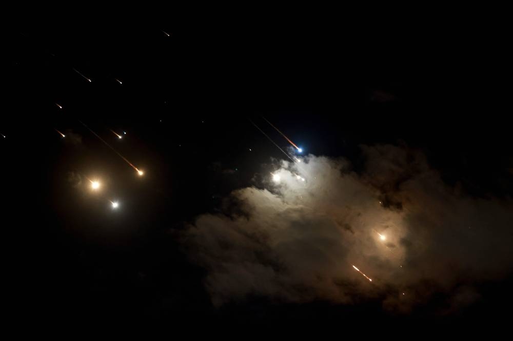 Iranian launched projectiles being intercepted by Israel above Jerusalem, on Tuesday. AFP