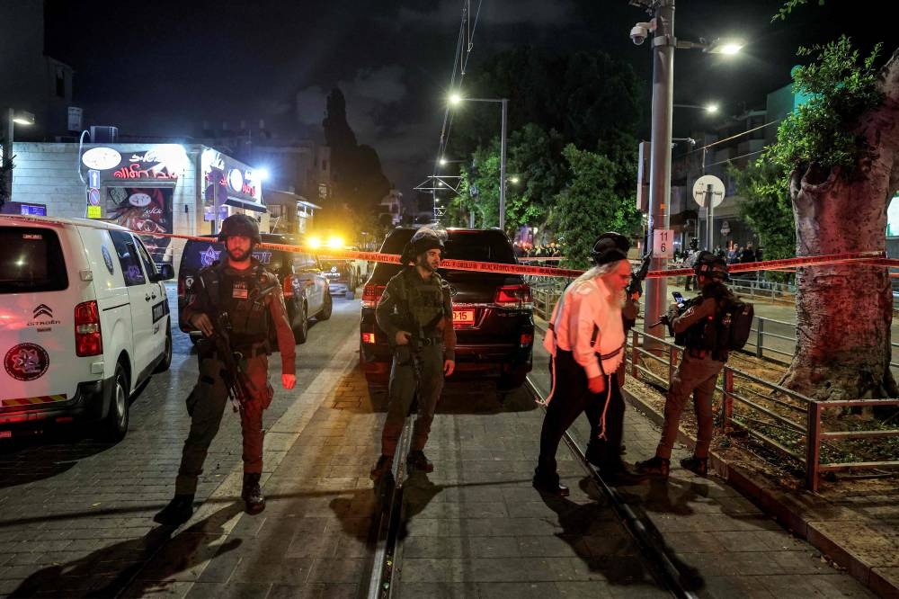 Israeli border guards deployed at the scene of a shooting attack near the Ehrlich station of the Tel Aviv Light Rail in Jaffa south of Tel Aviv on Tuesday.  AFP