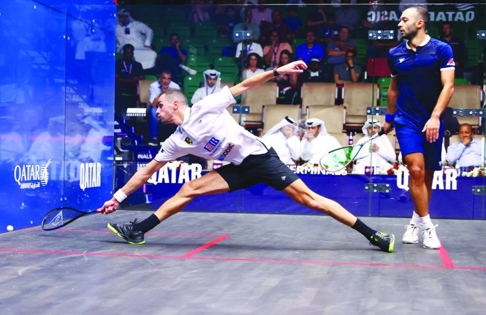 Defending champion Ali Farag of Egypt retrieves a low shot during his QTerminals Qatar Classic match against World No11 Youssef Soliman at the Khalifa Tennis and Squash Complex in Doha on Tuesday. 