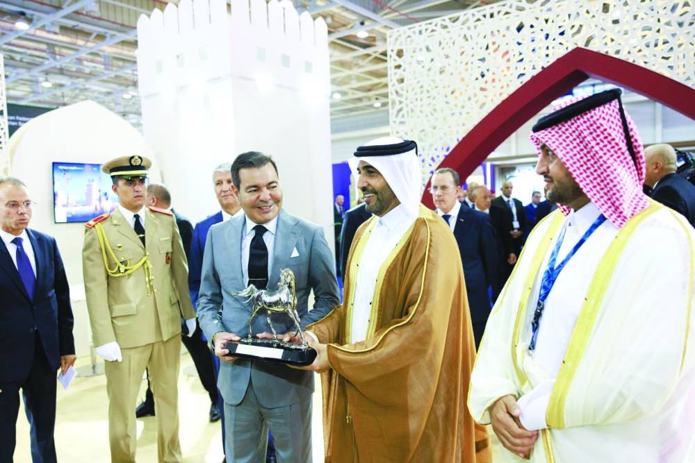 
QREC Chairman Issa bin Mohammed al-Mohannadi presented a shield to Prince Moulay Rashid in presence of Chargé d’ Affaires a.i. of Qatar Embassy in Morocco Abdulrahman bin Saleh al-Attiyah. 