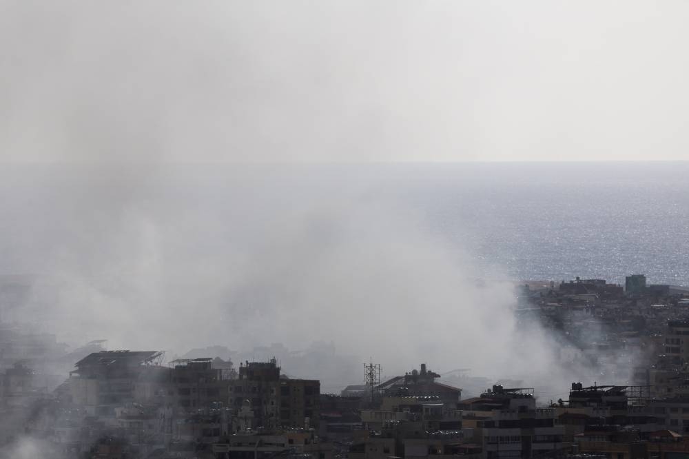 Smoke rises over Beirut's southern suburbs after an Israeli strike, as seen from Sin El Fil, Lebanon, on Wednesday. REUTERS