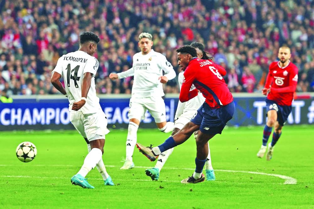
Lille’s Jonathan David scores against Real Madrid during the UEFA Champions League group stage match at the Pierre Mauroy Stadium in Villeneuve-d’Ascq, northern France. (AFP) 