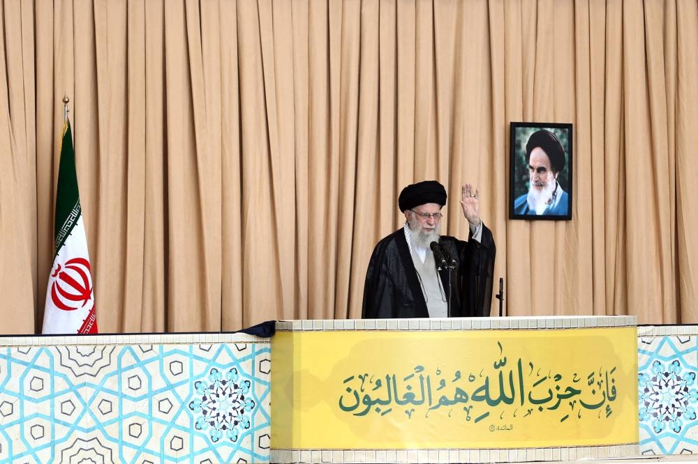 Iran's Supreme Leader Ayatollah Ali Khamenei waves during the Friday Prayers and a commemoration ceremony of late Lebanon's Hezbollah leader, Sayyed Hassan Nasrallah, in Tehran, Iran, Friday.