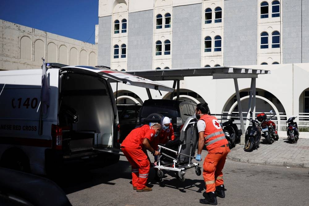Medics transfer a patient to the Rafik Hariri Hospital in Beirut, Lebanon, on Thursday. REUTERS