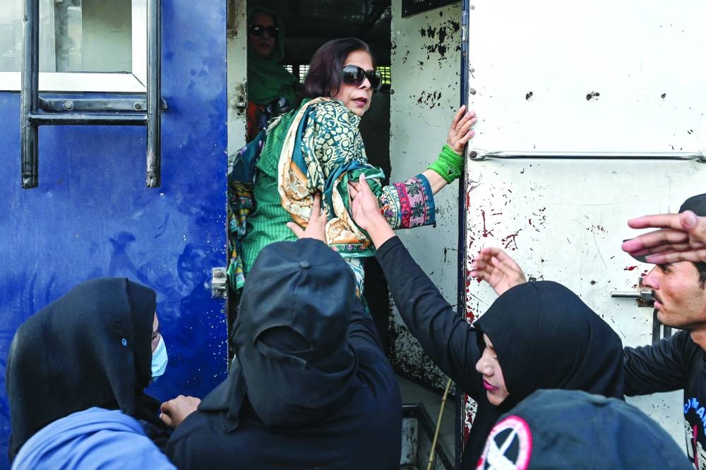 
Left: A PTI supporter is detained during a protest in Islamabad. – AFP 