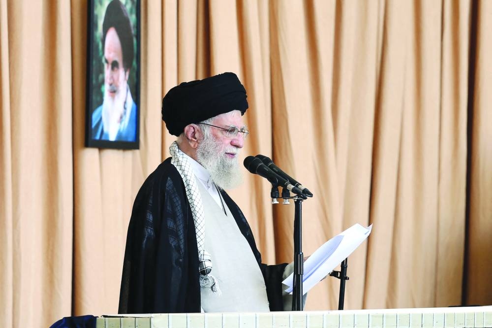 A handout picture provided by the Iranian Supreme Leader Ali Khamenei's office shows him speaking during the Friday prayer ceremony in Tehran on October 4, 2024. Iran's supreme leader Ayatollah Ali Khamenei, delivering a rare Friday sermon in Arabic, defended this week's missile attack on Israel that deepened fears of a regional war and praised allies' defiance. (Photo by KHAMENEI.IR / AFP) / RESTRICTED TO EDITORIAL USE - MANDATORY CREDIT "AFP PHOTO / HO / KHAMENEI.IR" - NO MARKETING NO ADVERTISING CAMPAIGNS - DISTRIBUTED AS A SERVICE TO CLIENTS