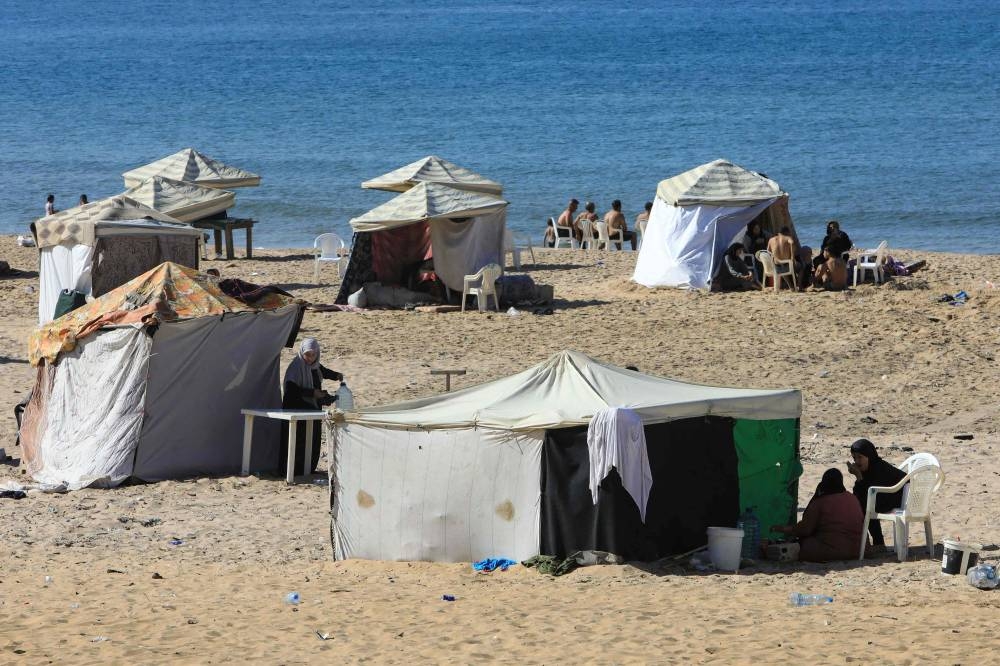 Tents are set up to be used as temporary shelters by people who fled Israeli bombardment, along the Ramlet al-Bayda public beach in Beirut , on Saturday. AFP