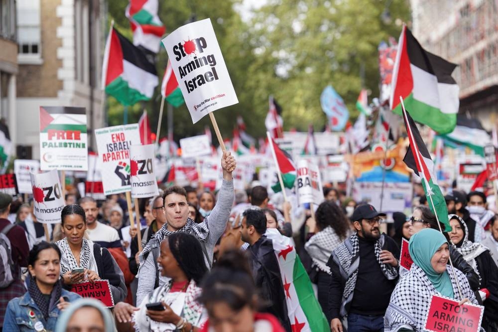 People hold placards and Palestinian flags during a demonstration in support of Palestinians in Gaza, ahead of the October 7 attack anniversary, in London, on Saturday. REUTERS