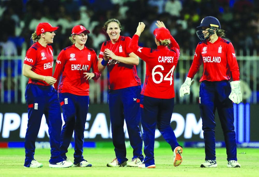 
England’s Nat Sciver-Brunt (centre) celebrates with teammates after taking the wicket of Bangladesh’s Ritu Moni during the Women’s T20 World Cup in Sharjah. (Reuters) 