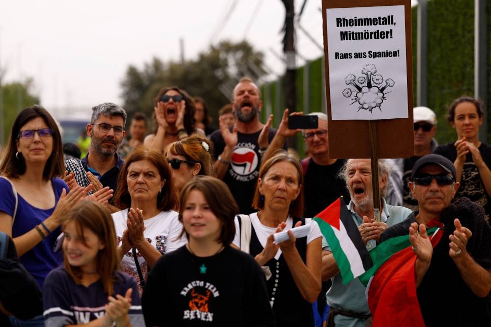 People take part in a protest in front of Rheinmetall Expal Munitions, an arms manufacturer of the Rheinmetall group, to stop arms sales to Israel and to end military operations in the Gaza Strip and the Israeli-occupied West Bank in Navalmoral de la Mata, Spain, on Sunday. REUTERS