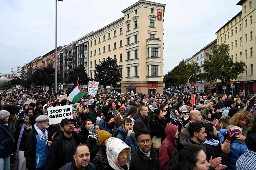 Participants march during a 'Demonstration against genocide in Gaza' near Kottbusser Tor square in Berlin's Kreuzberg district on Sunday. AFP