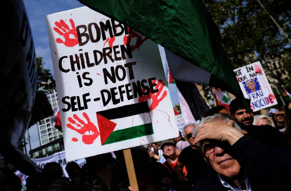 People demonstrate during a protest to express support for Palestinians in Gaza in Barcelona, Spain, on Sunday. REUTERS