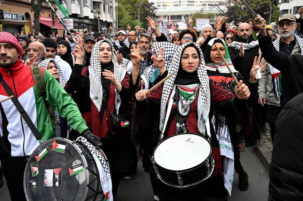 Demonstrators march during a rally under the slogan 'Palestine resists' near Kottbusser Tor square in Berlin's Kreuzberg district on Sunday. AFP