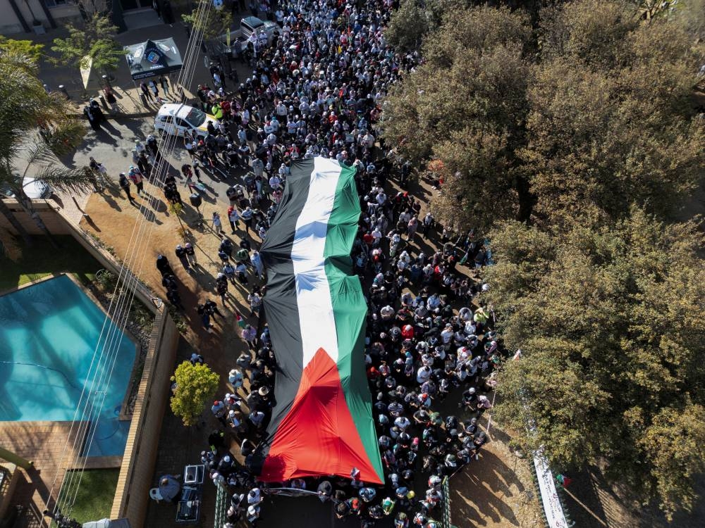 A drone view shows a giant Palestinian flag, as people march through the streets of the township of Lenasia, during the "Walk for Freedom" to protest against the ongoing Israel-Hamas conflict in Gaza, in Johannesburg, South Africa, on Sunday. REUTERS