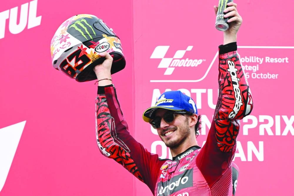 Ducati Lenovo Team rider Francesco Bagnaia of Italy celebrates his victory on the MotoGP class race podium of MotoGP Japanese Grand Prix at the Mobility Resort Motegi in Motegi, Tochigi prefecture yesterday. (AFP)