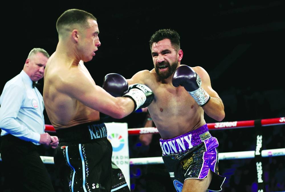 Ronny Rios in action with Nick Ball during their WBA featherweight title fight. (Action Images via Reuters)