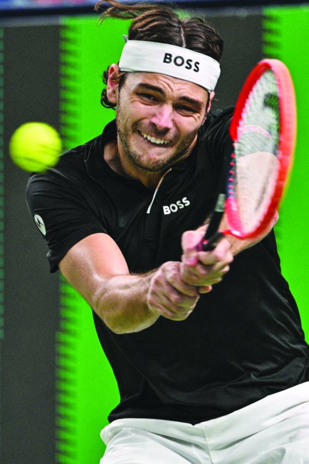Taylor Fritz of the US hits a return to France’s Terence Atmane during their match at the Shanghai Masters on Monday. (Reuters)