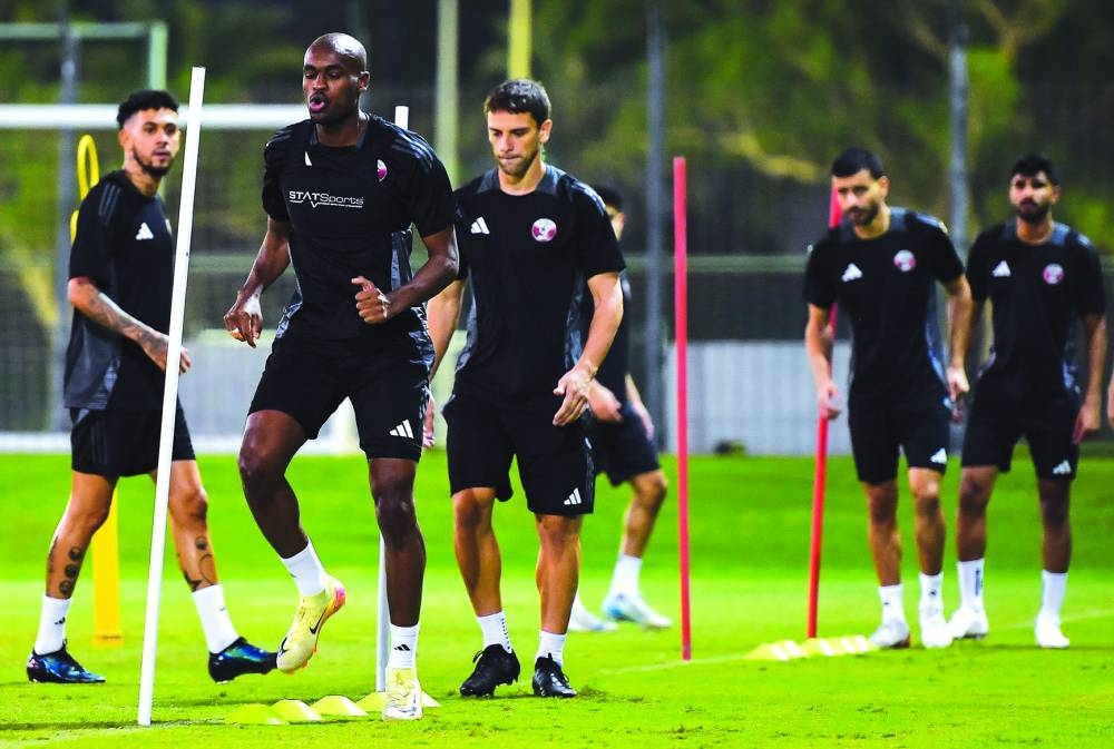 Qatar player Abdelkarim Hassan (centre, front) during a team training session in Doha on Wednesday. PICTURE: Noushad Thekkayil