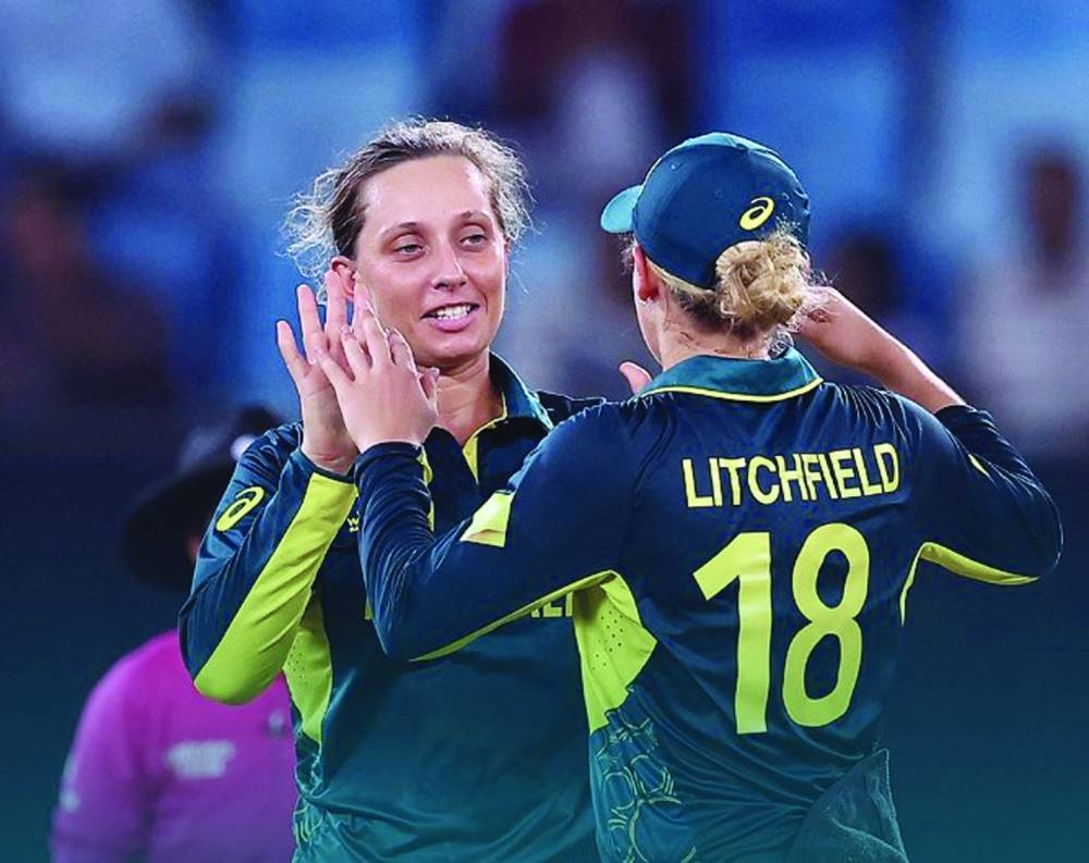 Australia’s Ashleigh Gardner (left) celebrates with teammate Phoebe Litchfield against Pakistan in their ICC T20 Women’s World Cup match in Dubai on Friday. (@AusWomenCricket)