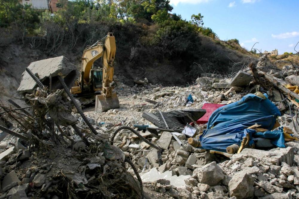 Rubble of a building that was destroyed during an Israeli airstrike that targeted the southern village of Bazuriyeh on Friday. AFP