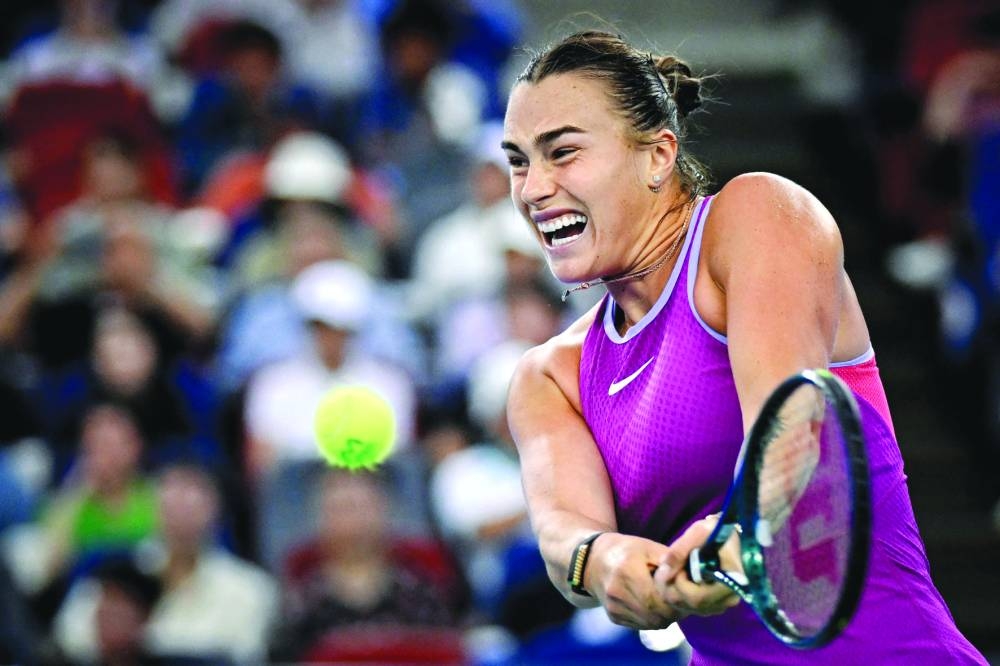 Aryna Sabalenka hits a backhand return to Coco Gauff during the semi-finals of the Wuhan Open in China’s Hubei province. (AFP)