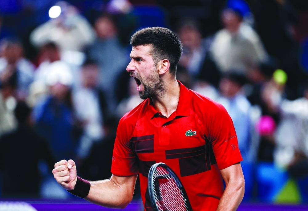 Serbia’s Novak Djokovic celebrates after winning his semi-final match against Taylor Fritz of the US at the Shanghai Masters on Saturday. (Reuters)