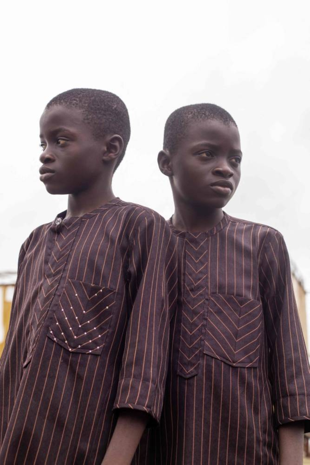 Taiwo and Kehinde pose for a photograph during the Igboora World Twins Festival 2024, in Igbo-Ora on Saturday. AFP
