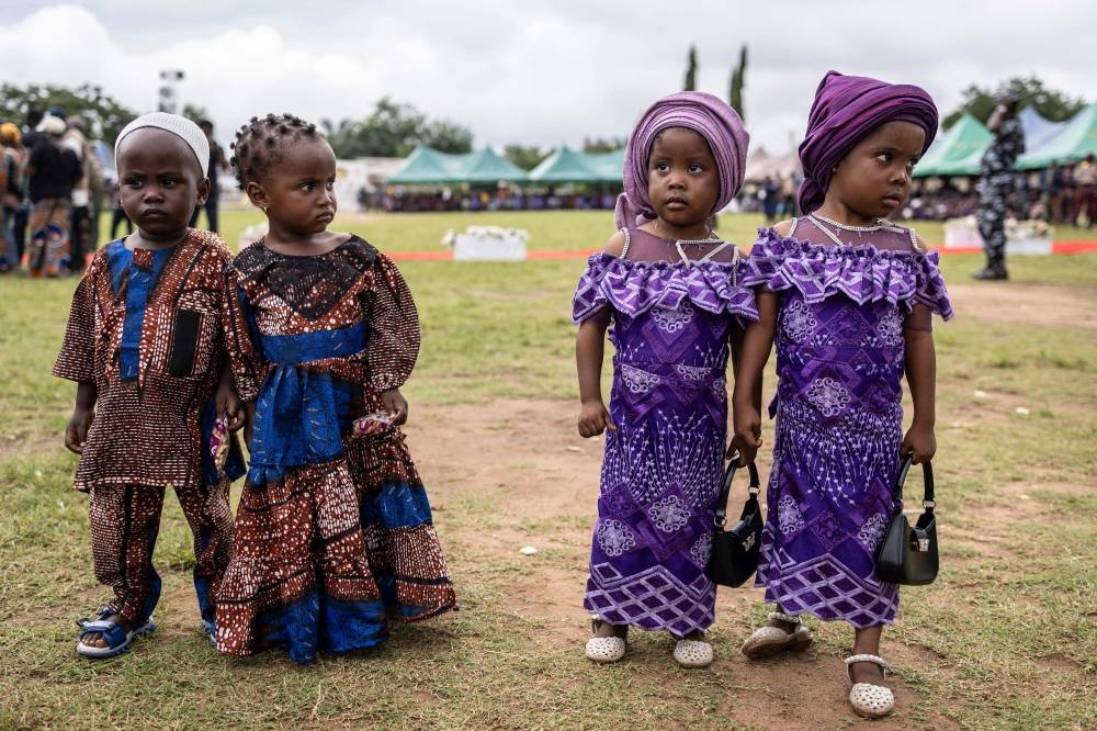 Twins pose for a photograph during the Igboora World Twins Festival 2024, in Igbo-Ora on Saturday. AFP