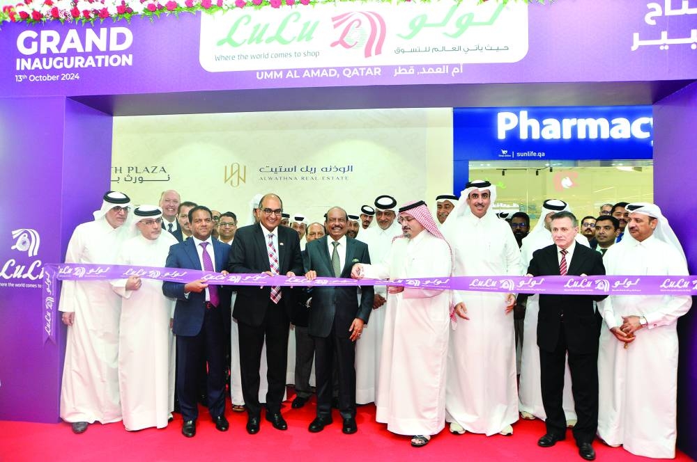 Sheikh Faisal Khalifa Sultan al-Thani cuts a ribbon to inaugurate the new outlet of LuLu as  Indian ambassador Vipul, Sheikh Mohammed bin Ahmed M A al-Thani, LuLu Group International chairman and managing director Yusuff Ali MA, group director-global operations and CSO Dr Mohamed Althaf and other dignitaries look on yesterday. PICTURES: Shaji Kayamkulam.