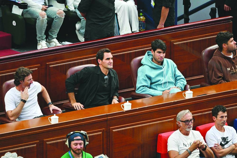 Former tennis player Roger Federer (second left) of Switzerland and Spain’s Carlos Alcaraz (right) watch Serbia’s Novak Djokovic and Italy’s Jannik Sinner play during their singles final at the Shanghai Masters on Sunday. (AFP)