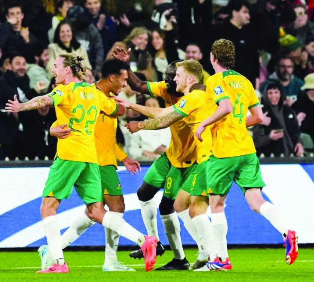 Australian players celebrate during their 3-1 win over China last Thursday. Australia, coached by Tony Popovic, take on hosts Japan at Saitama Stadium on Tuesday. (@Socceroos)
